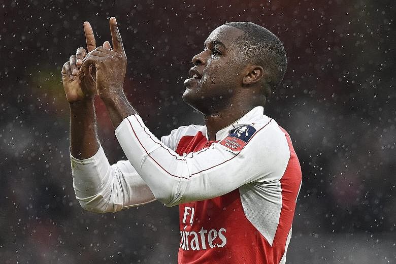 Arsenal's Joel Campbell celebrating after cancelling out Jeremain Lens' opener during their FA Cup third-round match yesterday. The Gunners beat Sunderland 3-1 with Adam Ramsey and Olivier Giroud scoring the other two goals.