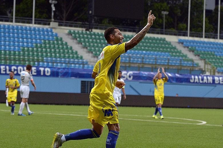 Top and above: Pennant celebrating Tampines' second goal, which was scored by Shakir Hamzah, last night. Moments earlier, the Englishman had provided the looping cross for Shakir to score. Right: The former Arsenal and Liverpool winger proved a hit w