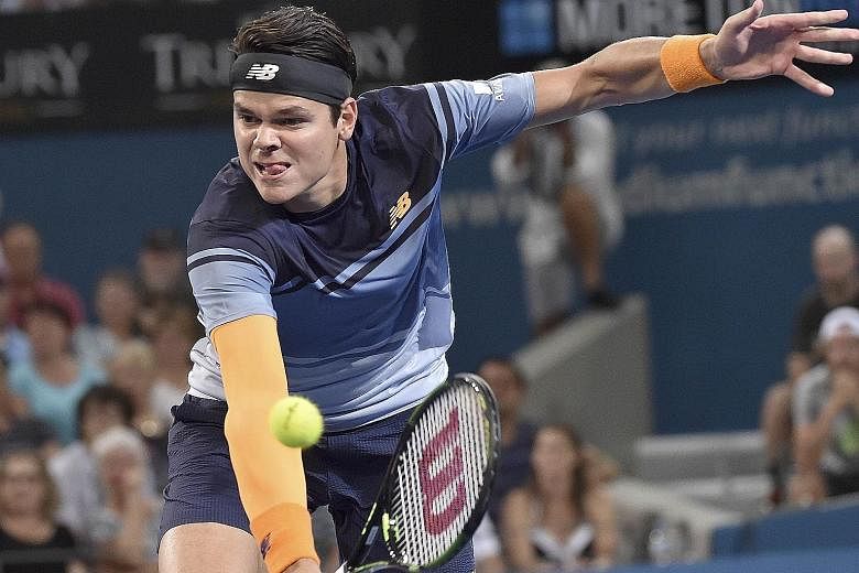 Milos Raonic hitting a backhand return against Roger Federer during the Brisbane International final. The Canadian beat the Swiss tennis maestro 6-4, 6-4 and said afterwards that he is confident that he could challenge for a Grand Slam title this sea