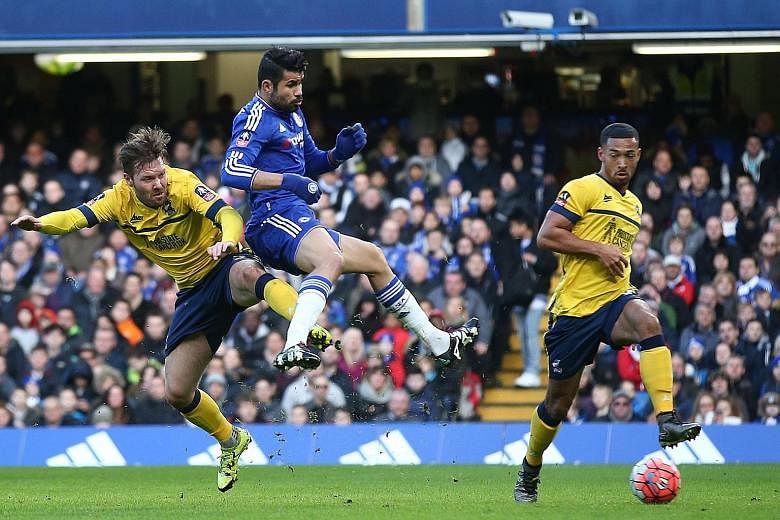 Despite the close attention of Scunthorpe defenders, Diego Costa (centre) was still able to find a way to score Chelsea's opening goal in their FA Cup third-round tie.