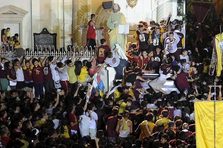 Two people died and hundreds were injured during the festival of the Black Nazarene in the Philippines, where crowds of barefoot people hurled themselves at a statue of Jesus believed to have healing powers, the authorities said. More than a million 