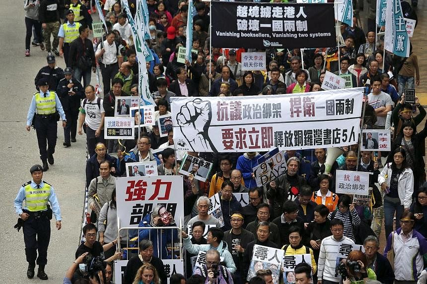 A protest march in Hong Kong yesterday demanding the release of five booksellers who are feared to have been detained by the mainland authorities.