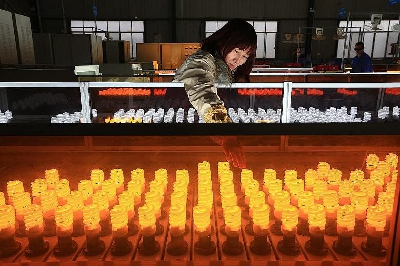 A lightbulb production line in Sichuan province. Key Chinese data due out on Jan 19 could weigh heavily on the local market.