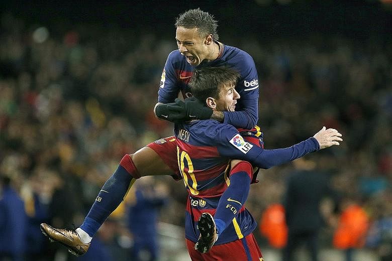 Neymar (top) celebrating a Barcelona goal with team-mate Lionel Messi. The Brazilian striker is poised to become a serious contender for the Ballon d'Or in the coming years, especially since his age of 23 is an advantage over Messi, 28, and Cristiano