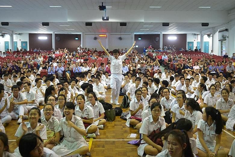 Many schools celebrated their top achievers yesterday even though the Education Ministry did not name the top scorers. At Chung Cheng High School (Main) (above), the students who had received at least five distinctions were named when principal Chan 