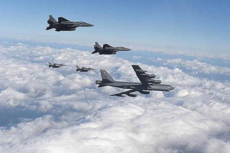 A US B-52 strategic bomber flying over South Korea on Sunday with fighter jets from both countries, in a show of force following the North's nuclear test.