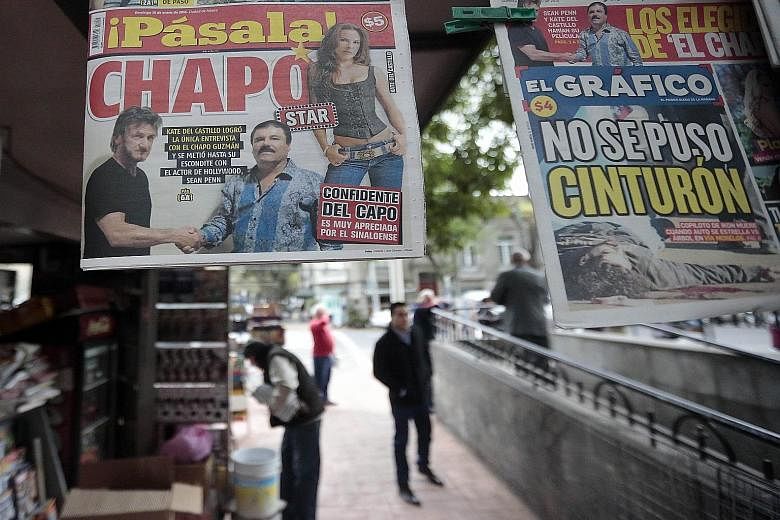 A newspaper, displayed at a newsstand in Mexico City on Sunday, shows a picture of drug lord Guzman (in blue striped shirt) with US actor Sean Penn. The actor, who wrote about his clandestine meeting with Guzman last October, has been criticised on e
