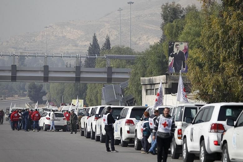 A convoy of Red Cross, Red Crescent and UN trucks gathering in Damascus yesterday before heading to Madaya, Fuaa and Kafraya. Forty-four trucks will go to Madaya carrying food, water, infant formula, blankets and medical supplies. Aid has not entered