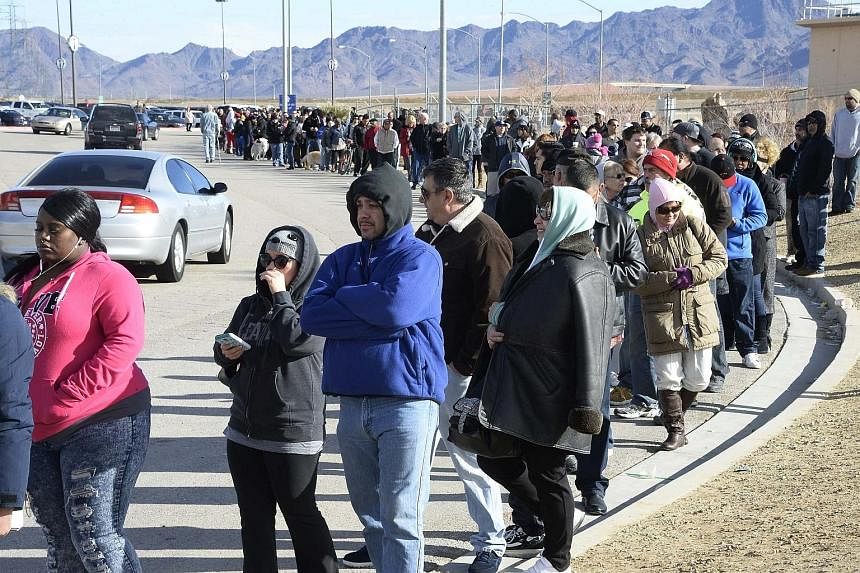 People waiting in line to purchase tickets for the Powerball lottery in San Bernardino, California, last Saturday. The odds of winning are just one in 292 million, but Americans are trying their luck, lured by the huge jackpot.