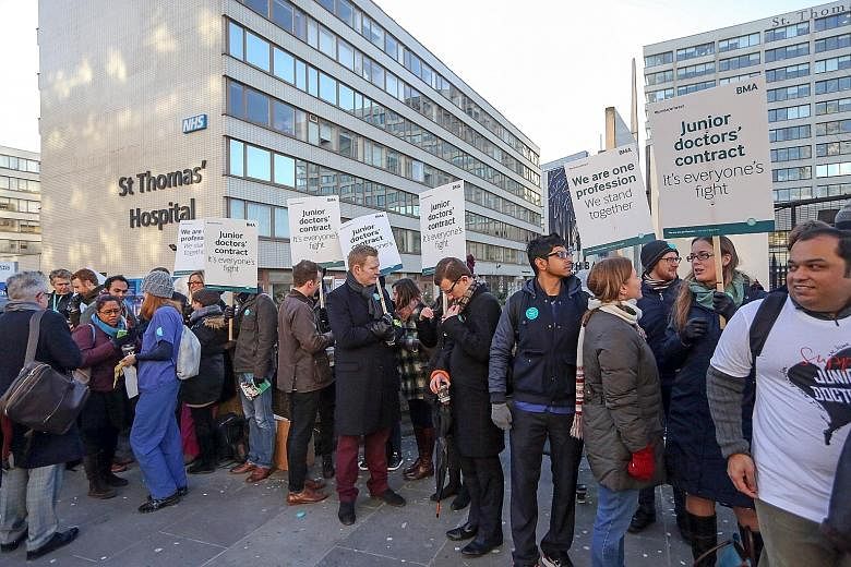 Unhappy over a new government contract, junior doctors at National Health Service hospitals went on strike in London yesterday.