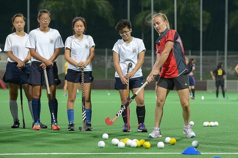 Australia forward Emily Smith, 23, guiding the girls from the TPG Academy Development Squad in a clinic held by the world No. 3 Hockeyroos ahead of the TPG International Tri-Series hockey tournament next week. The top-ranked Dutch and world No. 9 Ger