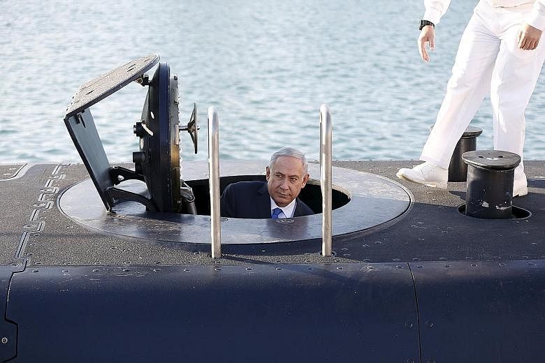 Israeli Prime Minister Benjamin Netanyahu touring the German-made Rahav submarine on its arrival at Haifa port on Tuesday.