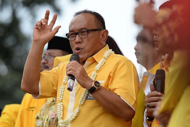Golkar chairman Aburizal Bakrie on the campaign trail during the Indonesian presidential election in 2014. On Monday, he pledged to support the government after a meeting with Mr Joko.