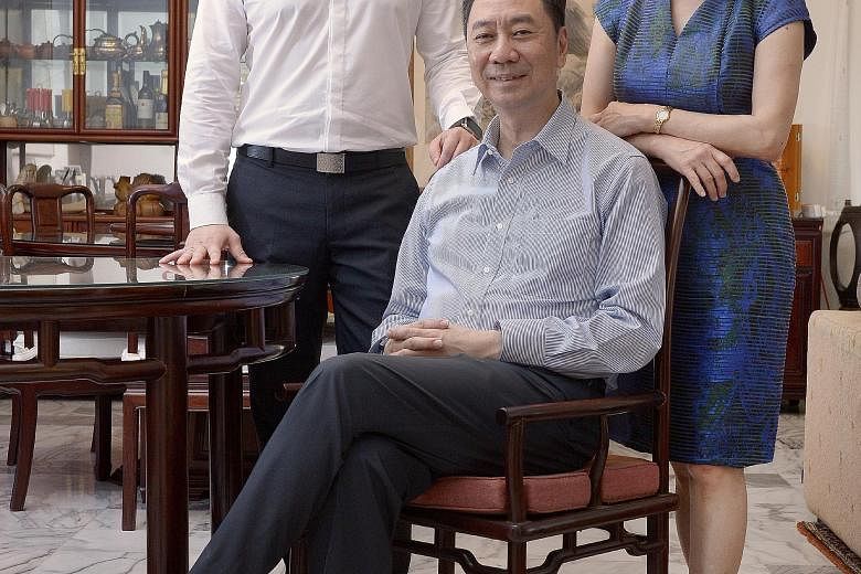 Ms Tay with her husband, Mr Chew, and their son Ken. Ms Tay, who started Primefield to sell WordPerfect and PCs, also started a digital kiosk business in China.