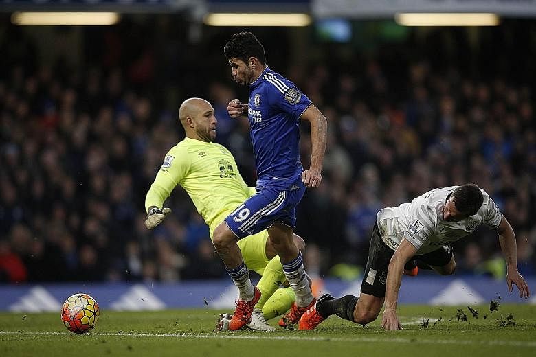 Diego Costa (centre) started Chelsea's comeback from two goals down. The striker, chasing down a long ball with Everton defender Phil Jagielka (right), manages to evade goalkeeper Tim Howard and put the ball into an empty net.