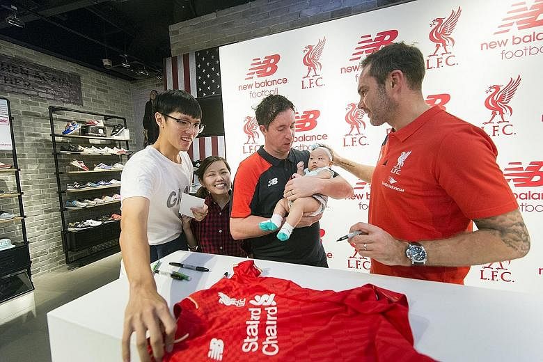 Robbie Fowler (in black) and Jason McAteer at New Balance and Courts events yesterday.
