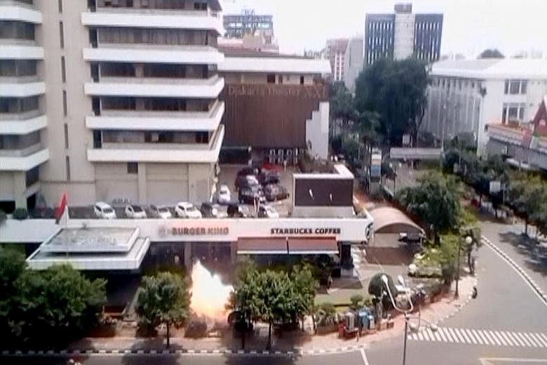 A bomb explosion is seen outside a Starbucks shop in Jakarta, Indonesia, in this still image taken from an amateur video shot last Thursday. While the brazen attack on the busy downtown street was shocking, the execution of the attack, however, seeme