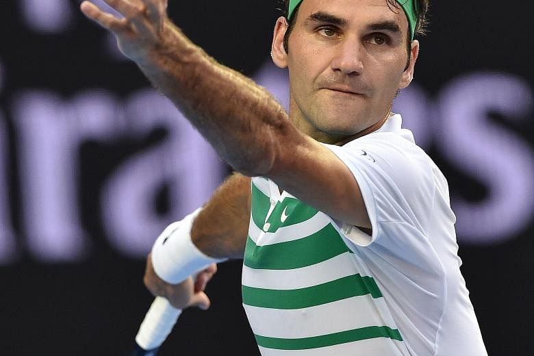Switzerland's Roger Federer serving during his match against Georgia's Nikoloz Basilashvili. He lost only five games.