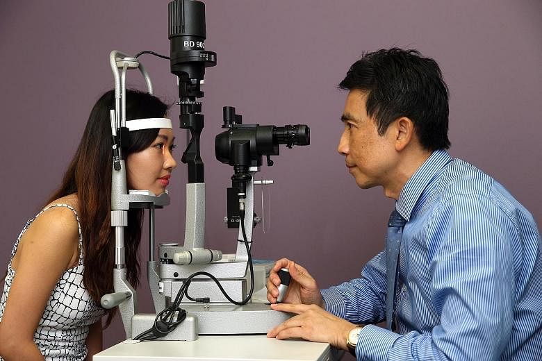 Yoga instructor Celestine Lau (above with Dr Lee Hung Ming) underwent Lasik surgery early last year.