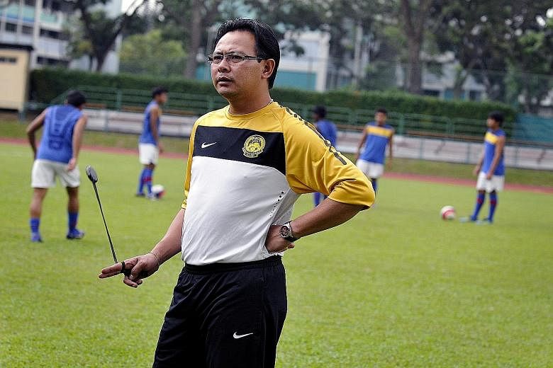 Ong Kim Swee taking charge of a training session when he was the coach of Harimau Muda A. The 45-year-old will take up a new role as his nation's coach and seek to improve Malaysia's dismal position of 171 in the Fifa rankings.