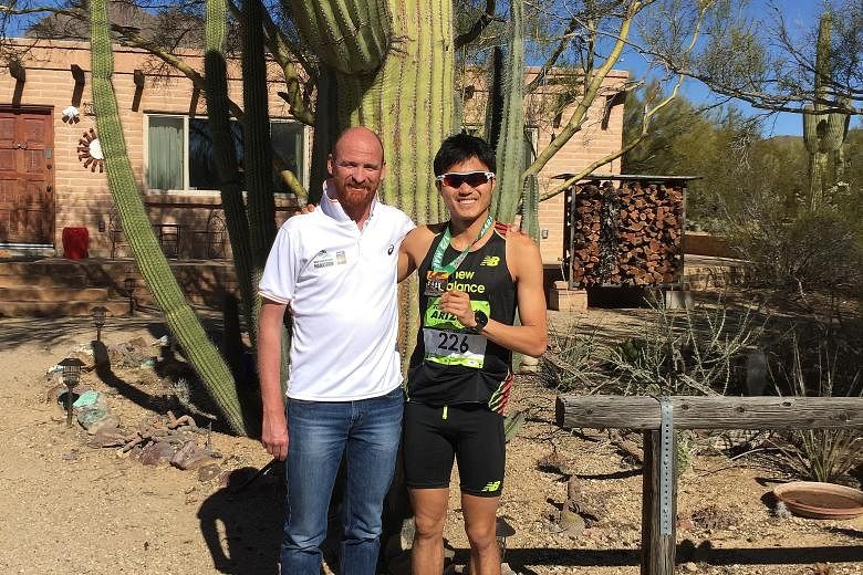 Mok Ying Ren with his coach Lee Troop. On Sunday, the Singaporean clocked a new national best time of 1:07:08 at the Arizona Rock 'n' Roll Half Marathon. He aims to qualify for the Rio Games by July 11.