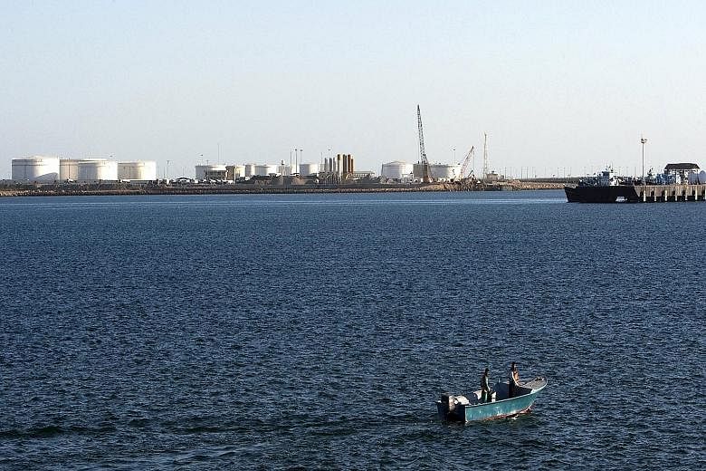 Oil docks at the port of Kalantari in the Iranian city of Chabahar. The country has activated plans to boost exports and lift oil production, a move that will continue to weigh down on oil prices amid a supply glut.