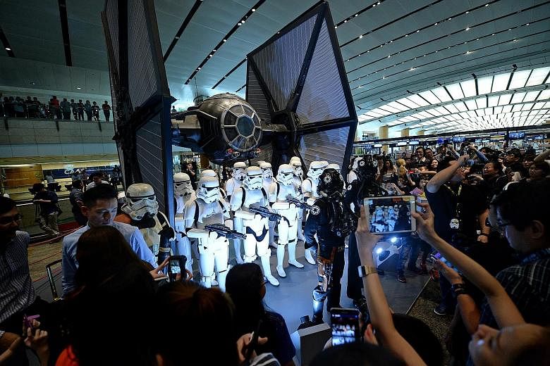 Star Wars fans coming face to face with Stormtroopers and the TIE fighter at Changi Airport last November. Over the years, US film company Disney has shifted its focus from cartoons featuring Mickey Mouse to blockbuster movies based on Marvel superhe
