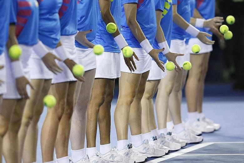 A performance by ball kids last Saturday, ahead of the Australian Open in Melbourne. There is intense speculation over the identities of the players under suspicion, eight of whom are reportedly in Melbourne.