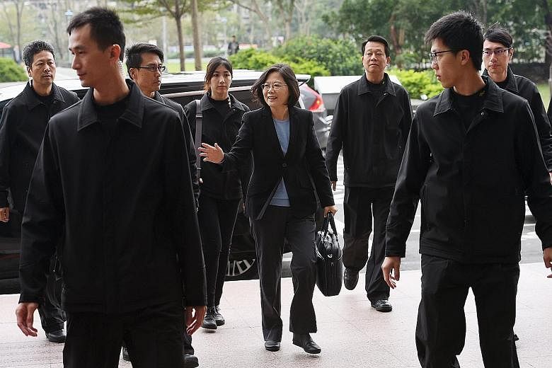 President-elect Tsai Ing-wen arriving at the DPP headquarters in Taipei yesterday, following the party's victory in last Saturday's presidential and parliamentary elections. The new DPP-majority legislature will be sworn in on Feb 1, but with a KMT p