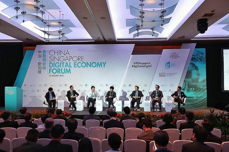At the China-Singapore Digital Economy Forum yesterday were (from left): Ms Han Yong Hong, Zaobao China news editor (moderator); Mr Tan Tong Hai, StarHub CEO; Mr Zhou Shou Zi, group chief financial officer, Xiaomi; Mr Zhang Qiang, chief operating off