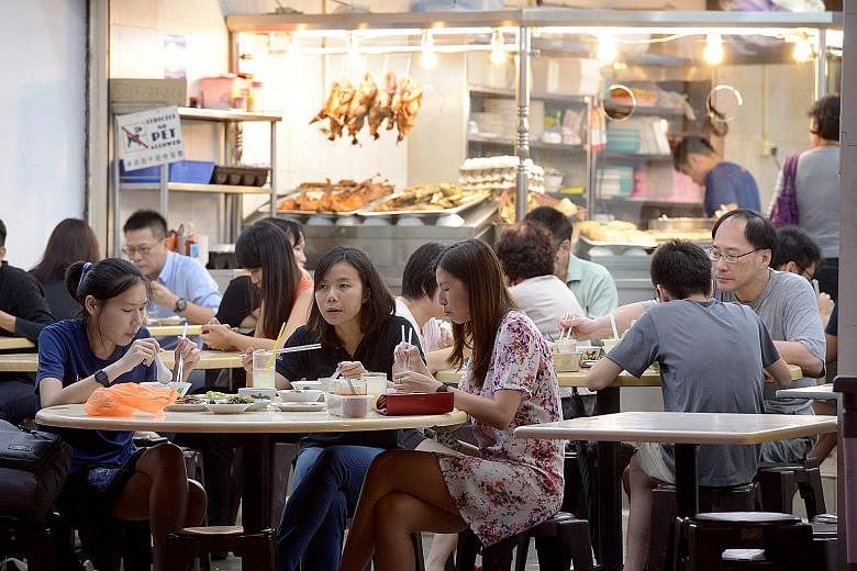 Customers at Joo Seng Teochew Porridge and Rice in Cheong Chin Nam Road on Monday evening. Since Downtown Line 2 opened late last month, business has improved for the row of eateries in Cheong Chin Nam Road (above) across the road from Beauty World C