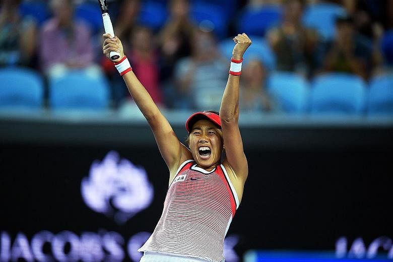 A jubilant Zhang Shuai celebrating her giant-killing act. The Chinese beat world No. 2 Simona Halep for her first Grand Slam win in 15 attempts.