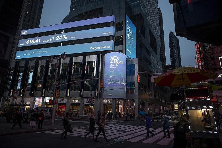 Morgan Stanley's Times Square headquarters in New York. The bank yesterday reported US$908 million (S$1.3 billion) in fourth-quarter profit and a revenue gain that exceeded analysts' estimates.