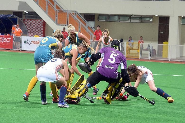 The Netherlands' winning margin would have been larger if not for Australian goalkeeper Ashlee Wells' fine display. She denied the Dutch from close range on several occasions, like in this goal-mouth melee.