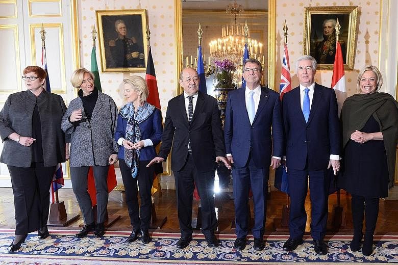 Military chiefs from seven nations - (from left) Australia's Marise Payne, Italy's Roberta Pinotti, Germany's Ursula Von Der Leyen, France's Jean-Yves Le Drian, the United States' Ashton Carter, Britain's Michael Fallon and the Netherlands' Jeanine H