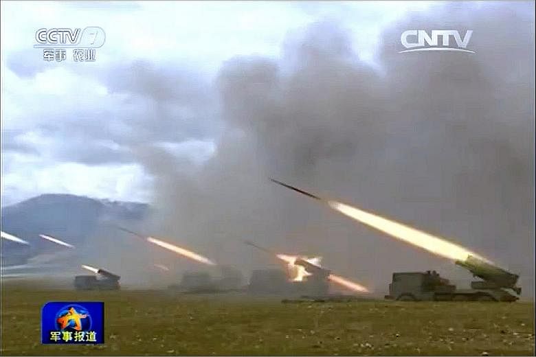 A screenshot from a report on Chinese state television's military channel about the 31st Group Army, based in the Chinese city of Xiamen, carrying out drills. The Wednesday report said the exercises were carried out in recent days, without giving an 