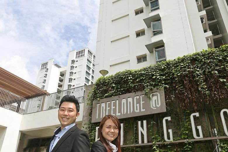 PropNex agents Godfrey Chan and Rosalind Teo at Treelodge@Punggol. They focus on Sengkang and Punggol and tailor their investment advice to their clients.