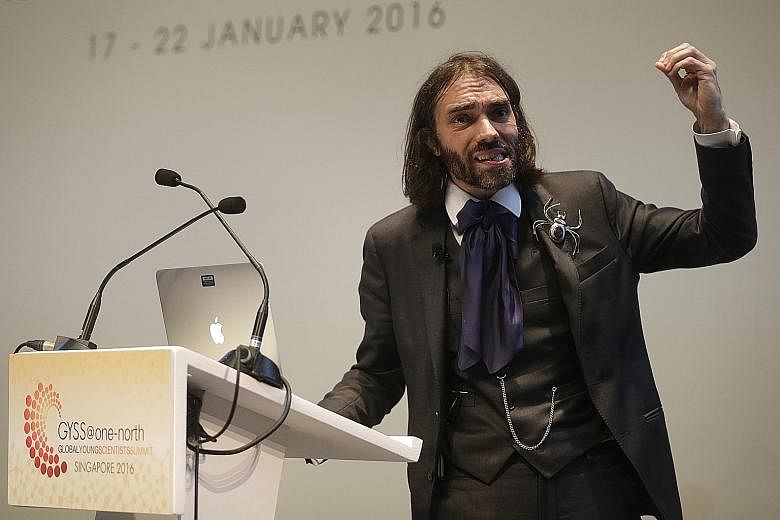 Professor Villani speaking at a plenary lecture at the Global Young Scientists Summit at SUTD on Tuesday. On his lapel is a spider brooch from Niger in sub-Saharan Africa, one of many specimens in his collection. Prof Villani was a 2010 recipient of 