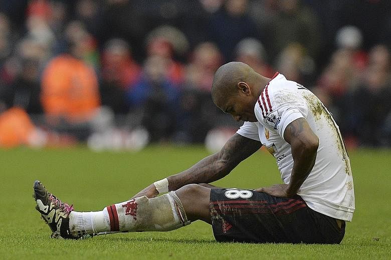 United midfielder Ashley Young sitting injured before being substituted during the 1-0 win over Liverpool at Anfield last Sunday.