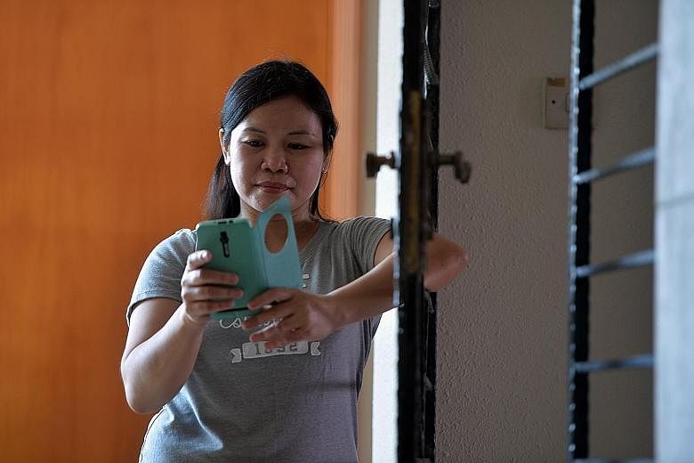 Filipino maid Nilda Sesaldo bought SMS codes through online portal BeamAndGo, which her teenage daughter used to redeem vouchers for groceries at the supermarket and a new phone at a local shop.