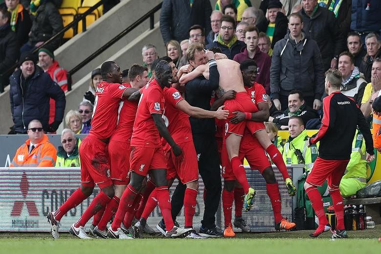 Clockwise from top: Adam Lallana celebrating by jumping onto Juergen Klopp after scoring Liverpool's fifth goal. The backheel opener from Norwich's Dieumerci Mbokani. Roberto Firmino on the double with the third goal for Liverpool.