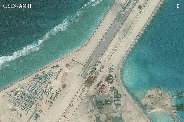 Part of the Subi Reef runway on an isle built by Beijing in the South China Sea. US Defence Secretary Ashton Carter has called on all parties in the region to stop actions which militarise the situation in the disputed South China Sea and pointed out