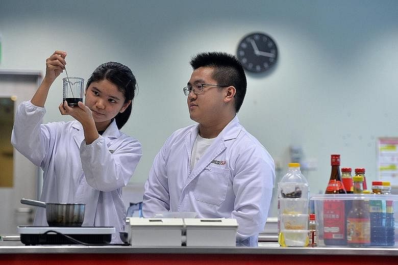 Singapore Polytechnic students Seah Xin Hui and Shaun Koh, who interned at the polytechnic's Food Innovation Resource Centre. From projects that the polytechnic undertakes,the proportion that gets commercialised has grown from around 10 per cent in 2
