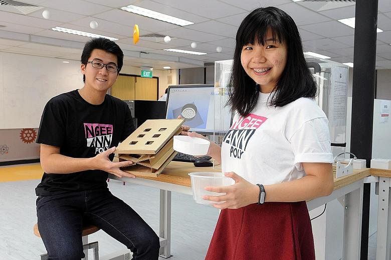 Gaines Goh and Winnie Lim at Ngee Ann Polytechnic's The Sandbox, an innovation and entrepreneurship office where students can brainstorm and test their projects. To help students develop their ideas, the polytechnic has supported about 250 student project