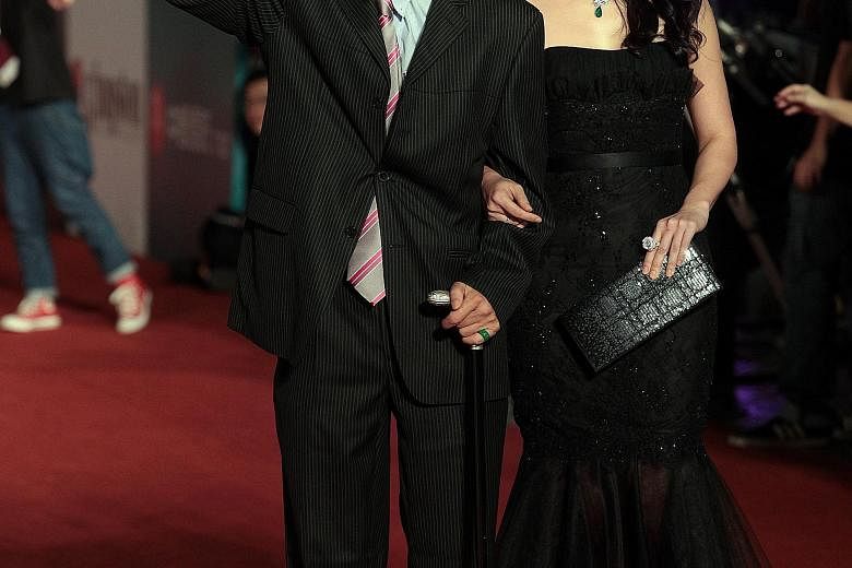 Taiwanese actor Wang Yu and his daughter Linda Wong (both left) arriving at the red carpet of the 50th Golden Horse Awards presentation ceremony in 2013.