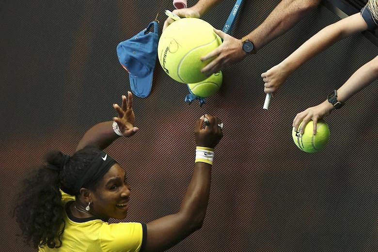 World No. 1 Serena Williams signing autographs for fans after winning her fourth-round match 6-2, 6-1 against Russia's Margarita Gasparyan at the Australian Open yesterday.