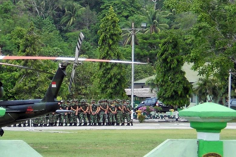 Indonesian troops arriving in Poso, Central Sulawesi, yesterday to join the hunt for Santoso, the leader of the East Indonesia Mujahidin terrorist group. Santoso is believed to be responsible for several attacks on the police in Central Sulawesi over