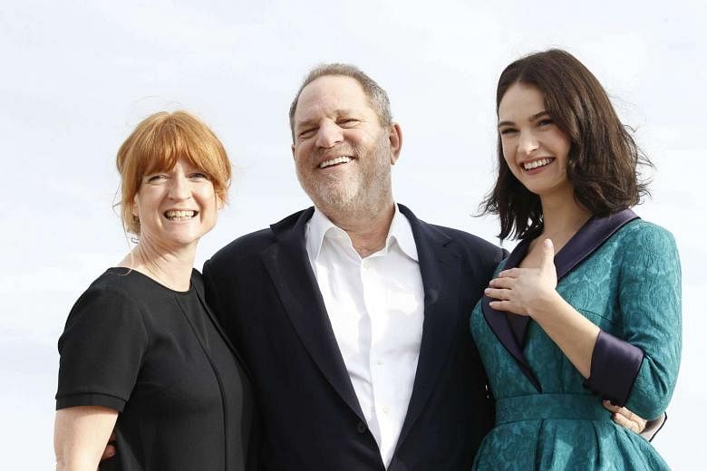 (From left) Executive producers Faith Penhale, and Harvey Weinstein, and British actress Lily James posing for the photocall of War And Peace in Cannes, France. 