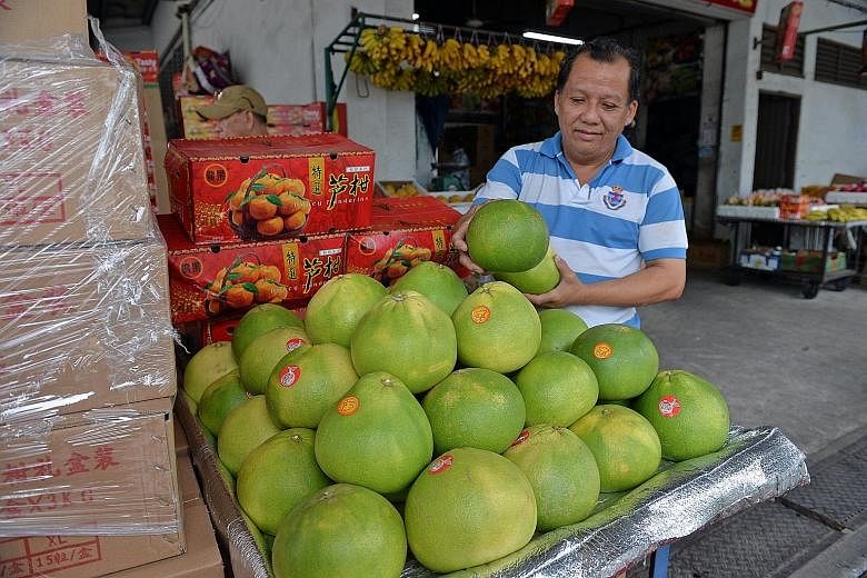 Pomelos on sale at Teck Kee fruit wholesaler. Malaysia's harvest of pomelos has fallen by nearly half due to last year's haze and rainy season, according to a report.
