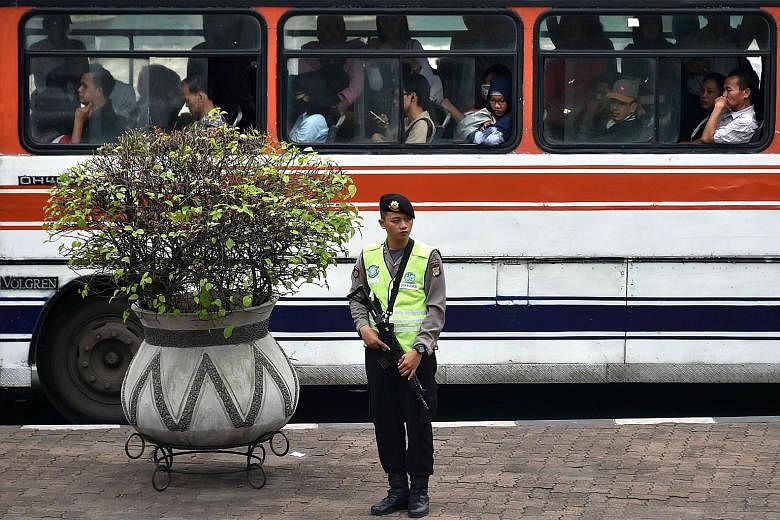 An armed policeman standing guard in Jakarta last Friday. The police's call for more funding to support its war on terror follows the Jan 14 attack by four local militants in Central Jakarta. "This is for anticipating threats from terrorists, regardl